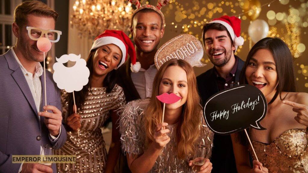 A group of festively dressed colleagues enjoying a business Christmas party, smiling and engaging in a fun pose.